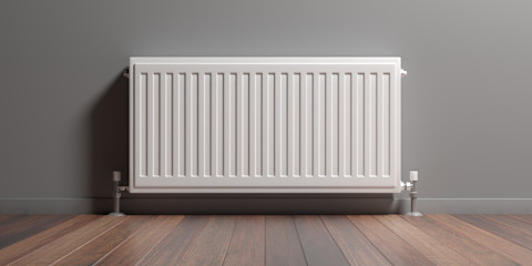 Moderne radiator aan een muur in een woonkamer met houten vloer.