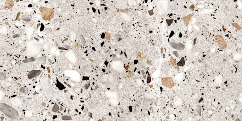 Prachtige granito vloer met mooie kleuren in het wit, beige en zwart met een schitterende glans 
