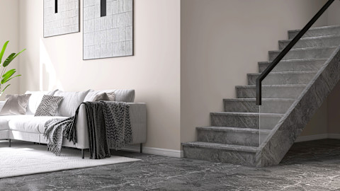 Luxe grijze trap van marmersteen in een modern interieur met strakke lijnen.
