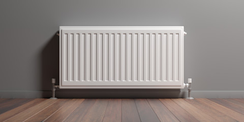 Persoon controleert met de hand of een radiator warmte afgeeft tijdens het stoken.