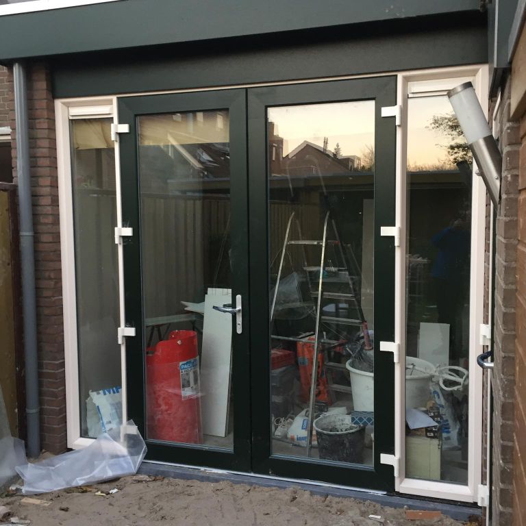 Vergroten woonkamer met deel van schuur en een aanbouw