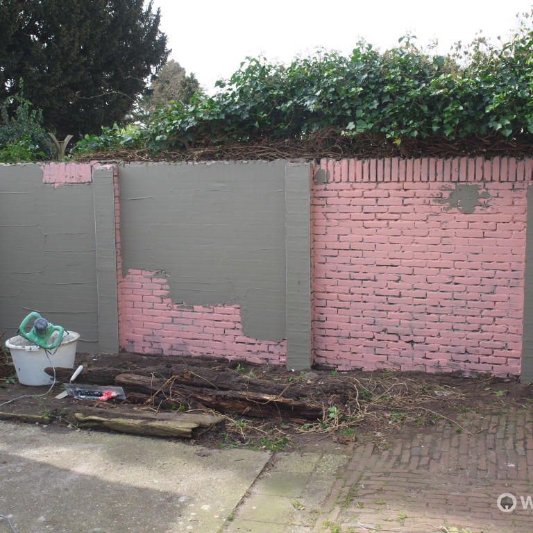 Stucen van kalkzandsteen erfscheiding 6 x 2 meter
