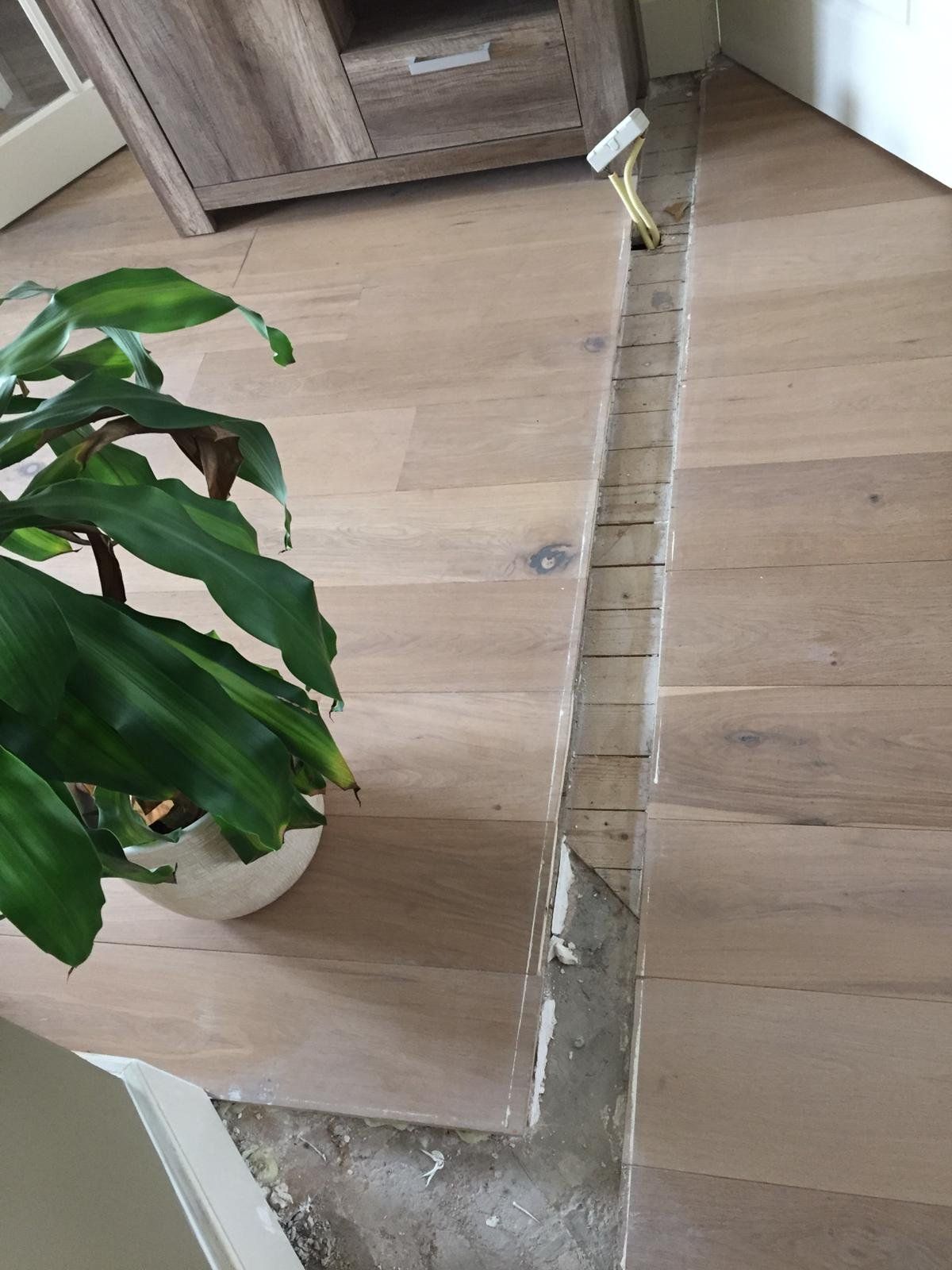 Opvullen 'gat' in houten vloer Werkspot