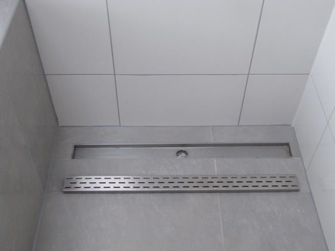 Opnieuw aanleggen afvoer douche en laten doorlopen wastafels Werkspot