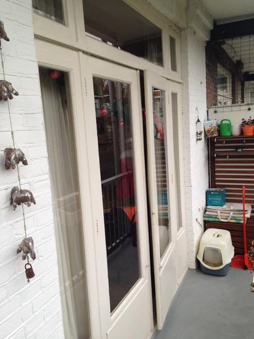 Achterpui met openslaande deuren naar balkon schilderen, plus plafo... Werkspot