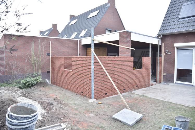 Plat dak verlengen op uitbouw garage Werkspot