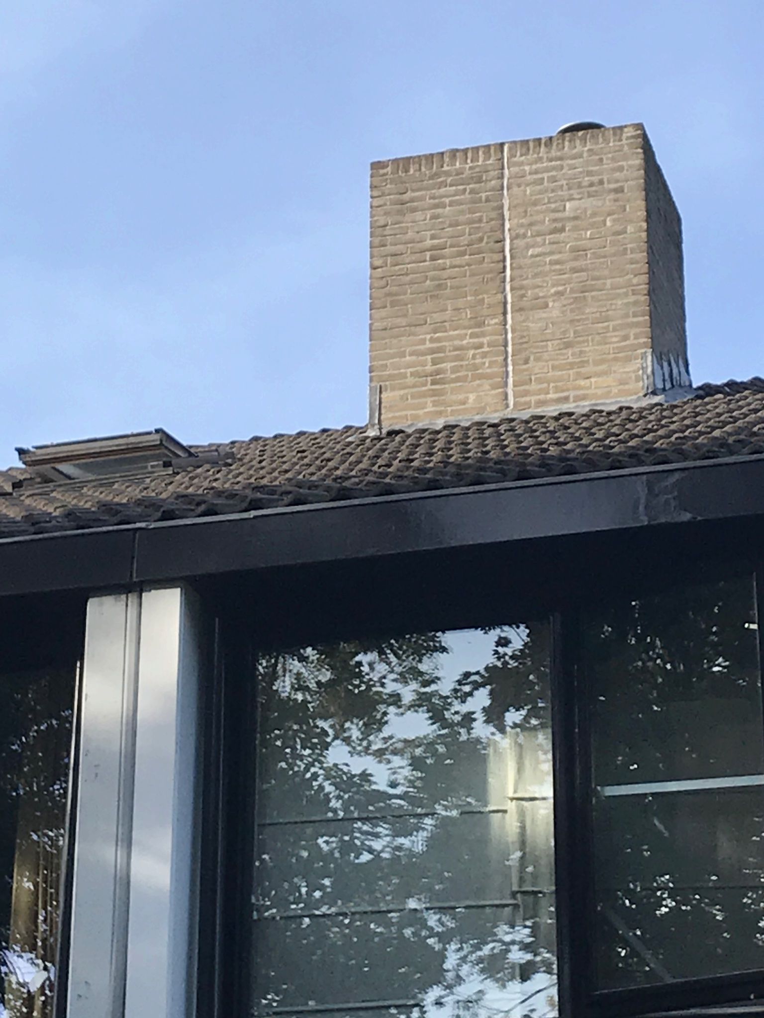 Schoorsteen en aansluiting op dak waterdicht maken Werkspot